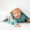 Baby posing under blanket - The Baby Photographers Inc.